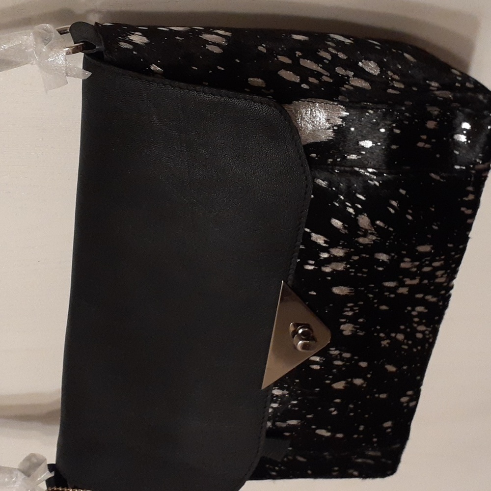 Black and silver leather handbag. ( Brand New )